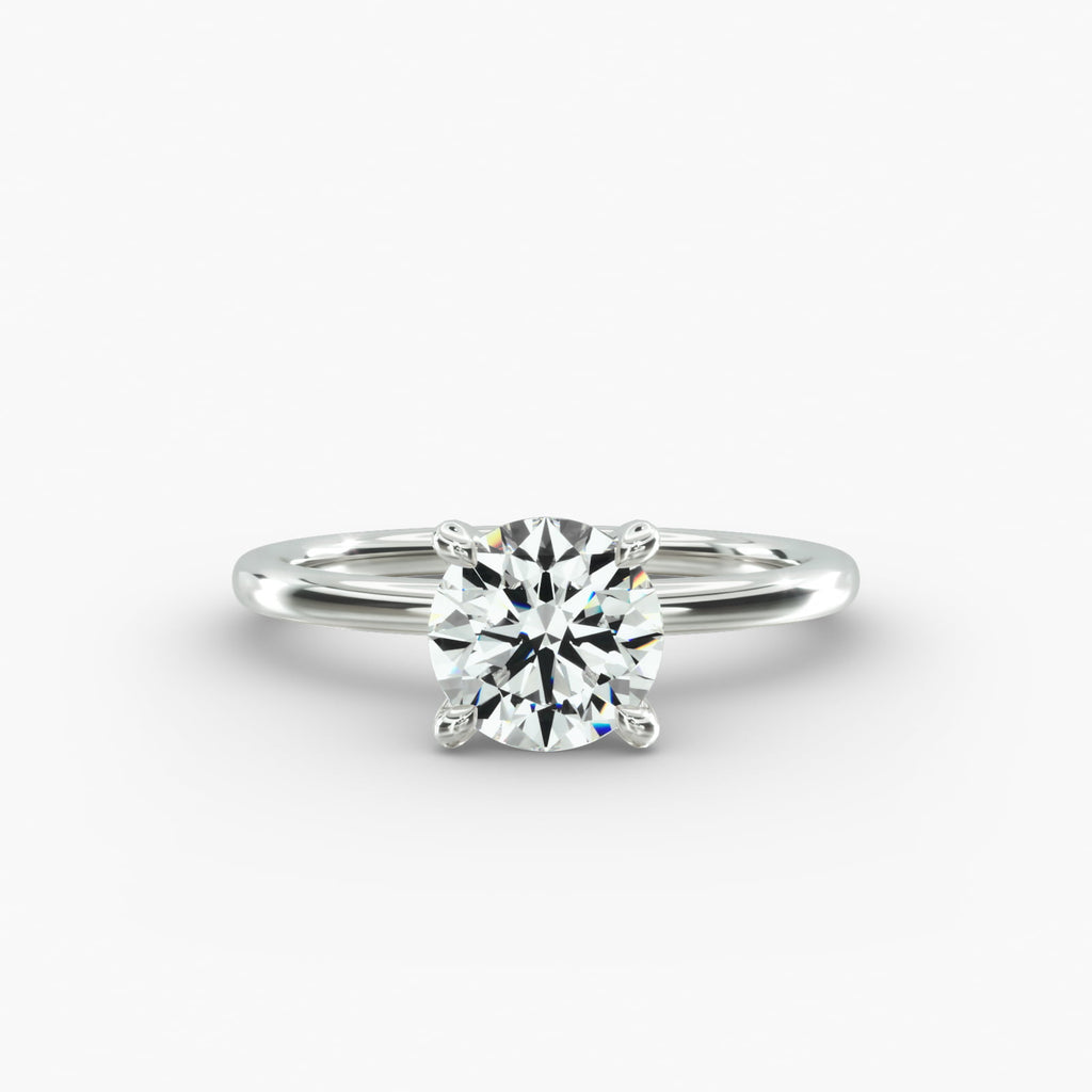 Classic round brilliant lab grown diamond solitaire engagement ring in 14K white gold.