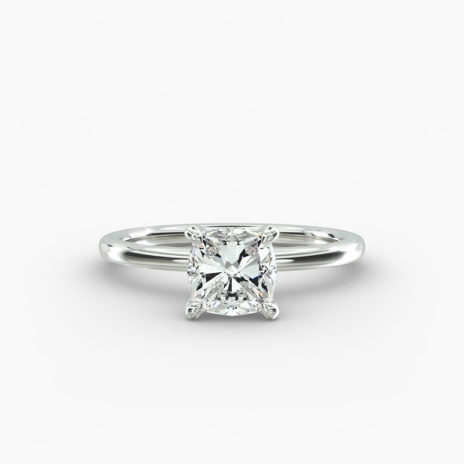 Cushion cut lab grown diamond solitaire engagement ring in 14K white gold.