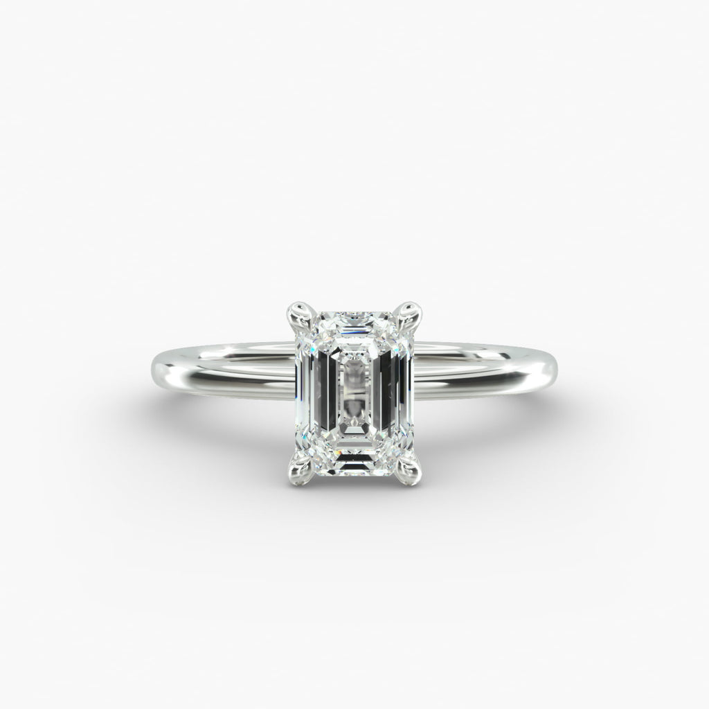 Emerald cut lab grown diamond solitaire engagement ring in 14K white gold.