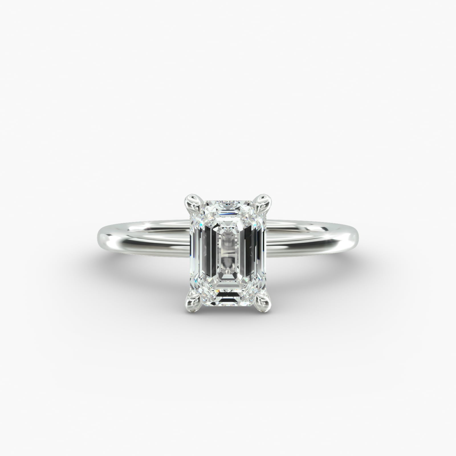 Emerald cut lab grown diamond solitaire engagement ring in 14K white gold.