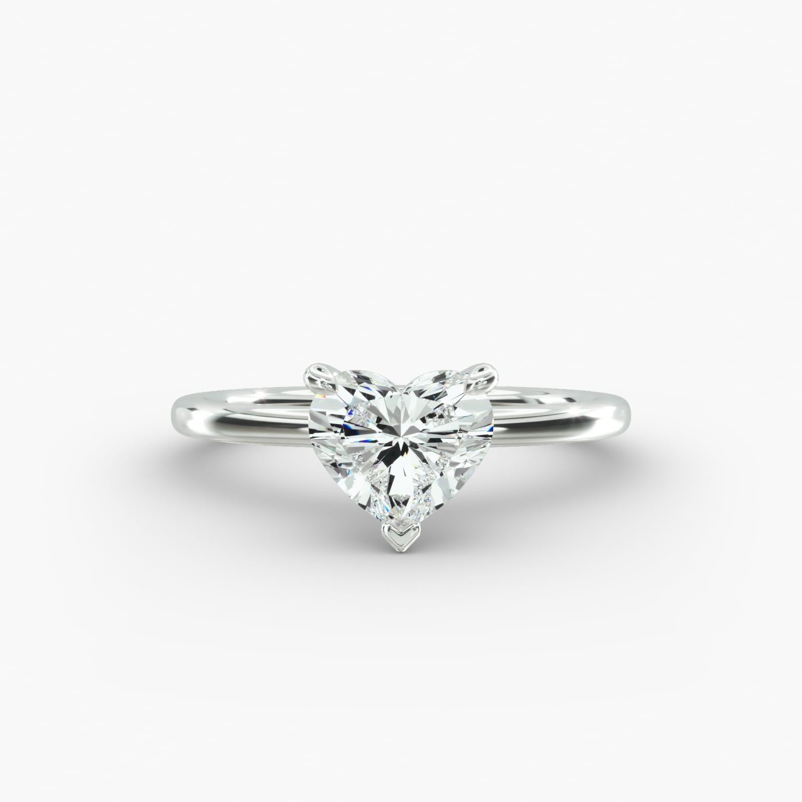 Heart shape lab grown diamond solitaire engagement ring in 14K white gold.