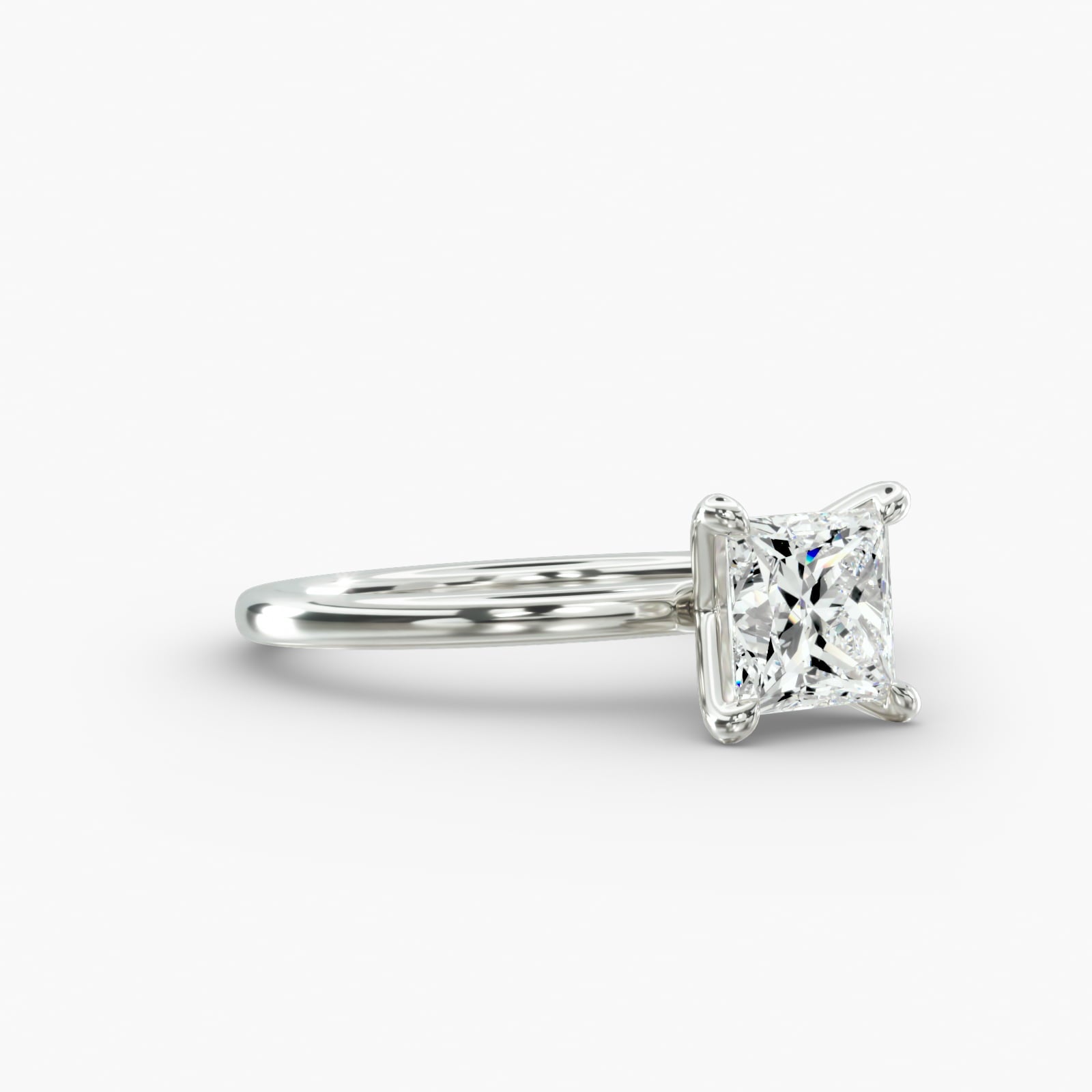 Minimalist princess cut lab grown diamond solitaire ring in 14K white gold side view.