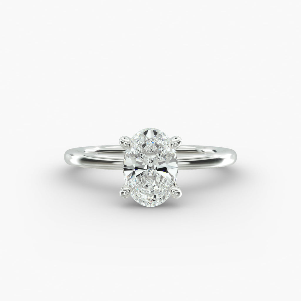 Oval cut lab grown diamond solitaire engagement ring in 14K white gold.
