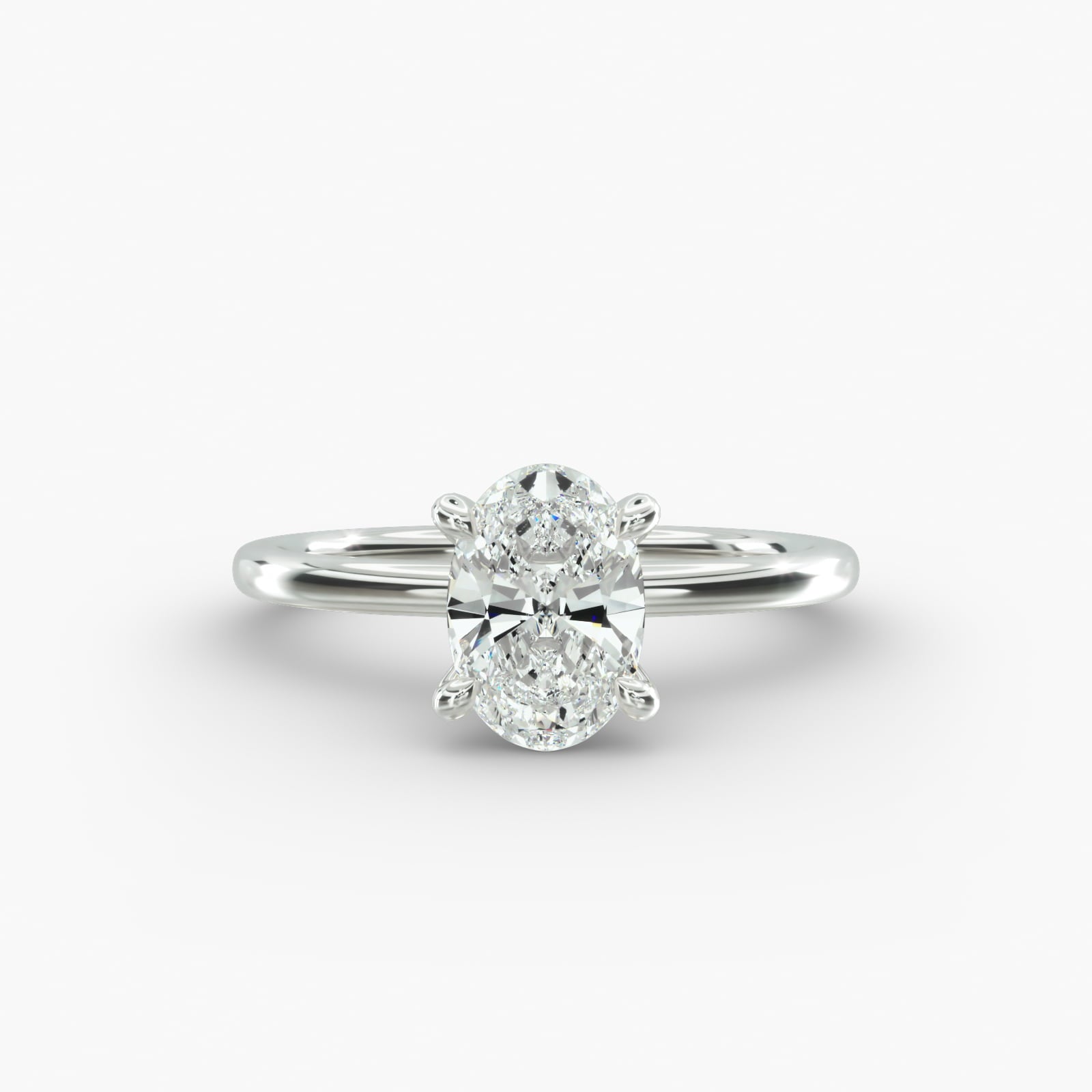 Oval cut lab grown diamond solitaire engagement ring in 14K white gold.
