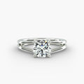 Round cut lab grown diamond split shank solitaire engagement ring in 14K white gold.