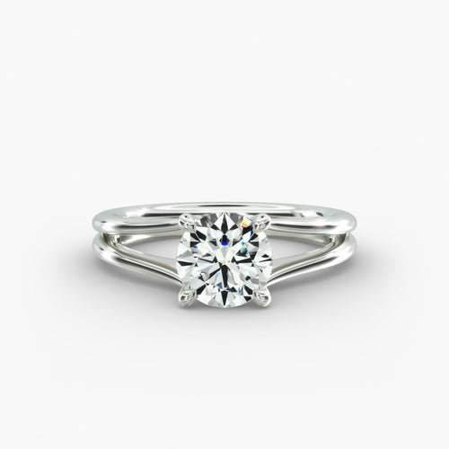 Round cut lab grown diamond split shank solitaire engagement ring in 14K white gold.